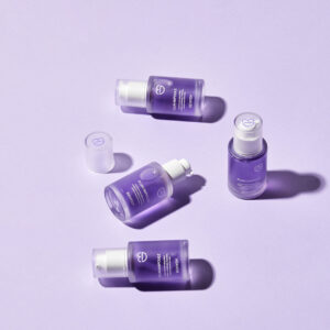 Behydy Plum Ampoule, 30mL, presented in a sleek glass bottle with a dropper for precise application. The design features a plum-inspired theme, emphasizing its nourishing and brightening properties for radiant skin. Perfect for enhancing your skincare regimen.