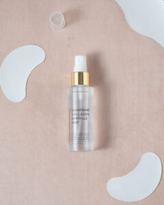 Dermarssance Highprime Collagen Ampoule Mist bottle flat lay with collagen patched around