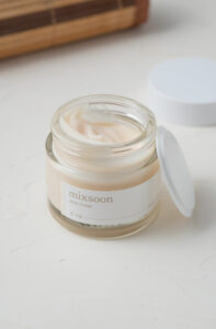 Open container of Mixsoon - Bean Cream 50ml with the lid on the side